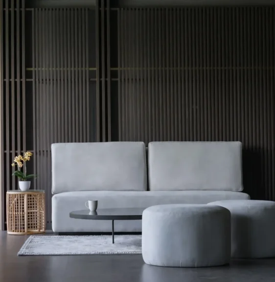 Modern lobby area at Forest Hills Hotel Ciwidey featuring minimalist furniture, neutral tones, and natural elements for a calm ambiance.